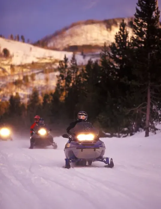 Framed Print : Snowmobilers at the end of the day in Yellowstone National Park