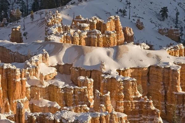 Snowy winter landscape of the hoodoo--a pillar of rock left by erosion--structures