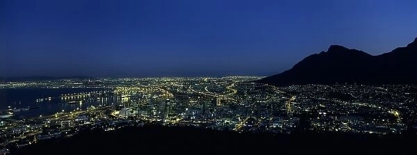 South Africa, Cape Town, Street lights of downtown skyline and Table Mountain, view