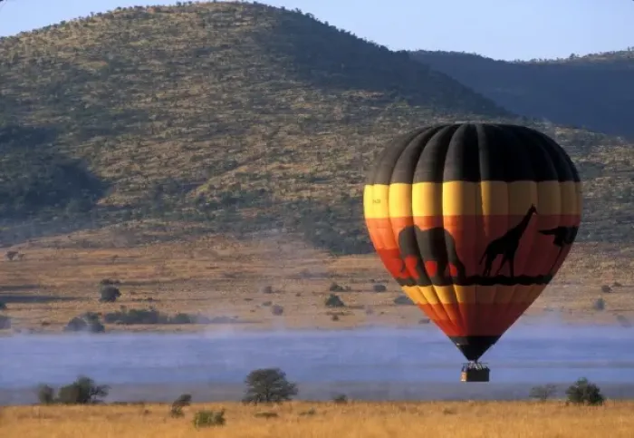 Framed Print : South Africa, Pilanesburg Game Reserve, Hot air balloon rises above mist-covered