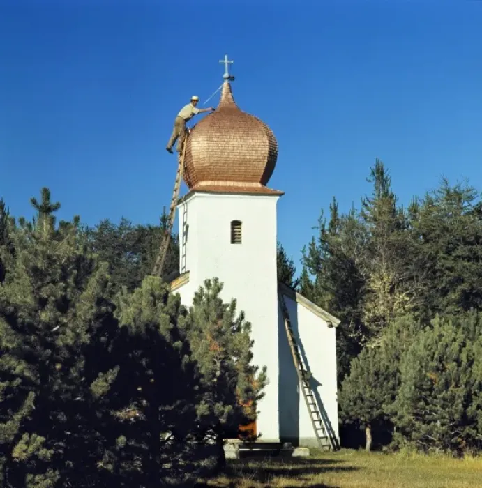 Framed Print : South America, Argentina, San Carlos de Bariloche. A man repairs the roof of a small Framed Print : South America, Argentina, San Carlos de Bariloche. A man repairs the roof of a small