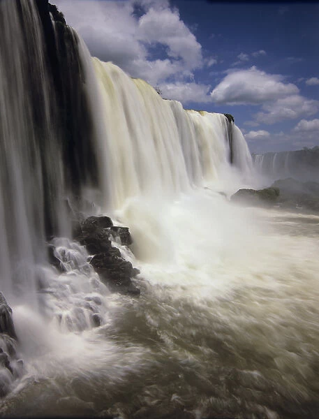 South America, Brazil, Igwazu Falls. Igwacu Falls drops gloriously in to the river below