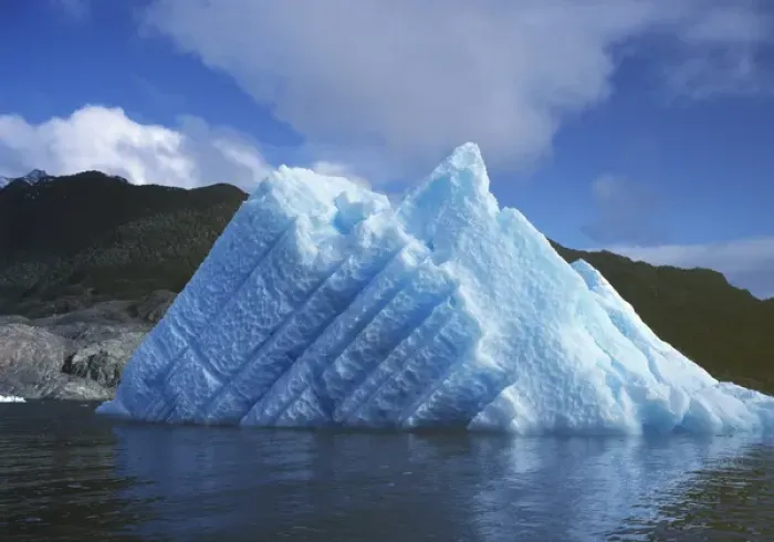 Framed Print : South America, Chile, San Rafael Lagoon NP. A striated, sun-touched iceberg floats Framed Print : South America, Chile, San Rafael Lagoon NP. A striated, sun-touched iceberg floats