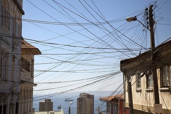 South America, Chile, Valparaiso. Electrical wires converge in a jumble on a pole
