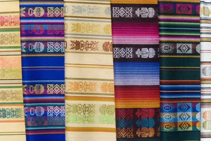 Framed Print : South America, Ecuador, Quito. Colorful shawls displayed at market