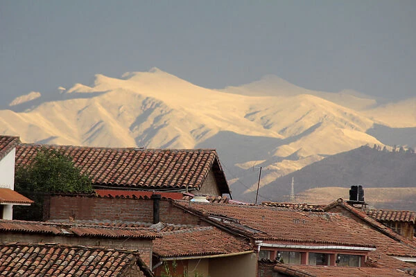 South America, Peru, Cusco. Rooftops and Mountains