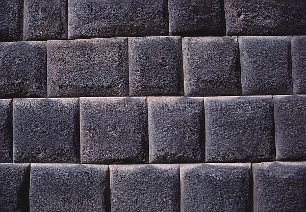 South America, Peru, Cuzco. This close-up of an Inca wall is a study in form, light and texture
