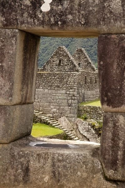 South America, Peru, Machu Picchu. Ruins of a house framed by a stone window. (UNESCO