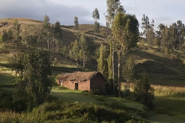 South America, Peru. A thatched roof house in the countryside. (UNESCO World Heritage