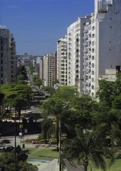 Framed Print : South America, Uruguay, Montevideo, sun-washed while buildings line a bisy residential Framed Print : South America, Uruguay, Montevideo, sun-washed while buildings line a bisy residential
