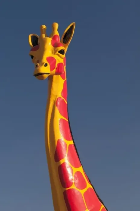 Framed Print : South Carolina, USA. A colorful Giraffee sculpture at the Mexican themed South of Framed Print : South Carolina, USA. A colorful Giraffee sculpture at the Mexican themed South of