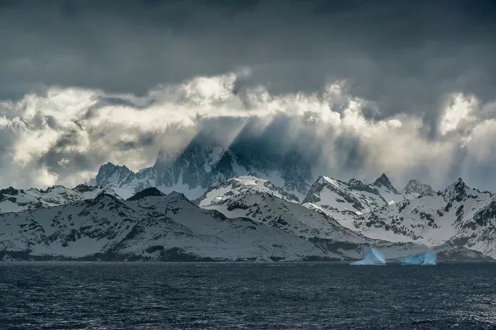 Framed Print : South Georgia Island. Opening in clouds and Virga reveal the mountainous and glaciated landscape Framed Print : South Georgia Island. Opening in clouds and Virga reveal the mountainous and glaciated landscape