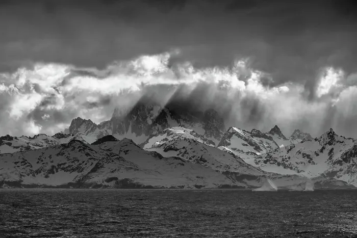 Framed Print : South Georgia Island. Opening in clouds and Virga reveal the mountainous and glaciated landscape Framed Print : South Georgia Island. Opening in clouds and Virga reveal the mountainous and glaciated landscape