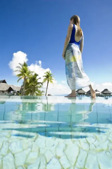 Framed Print : South Pacific, Bora Bora, female tourist relaxing at resort. (MR)