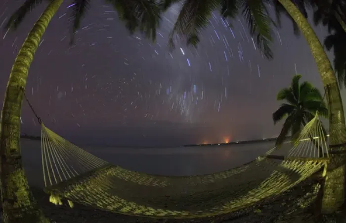 Framed Print : South Pacific, Cook Islands, Aitutaki. Stars rotate around the South Pole above a Framed Print : South Pacific, Cook Islands, Aitutaki. Stars rotate around the South Pole above a