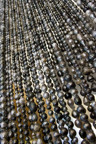South Pacific, French Polynesia, Society Islands, Bora Bora. Close-up of curtain of black pearls