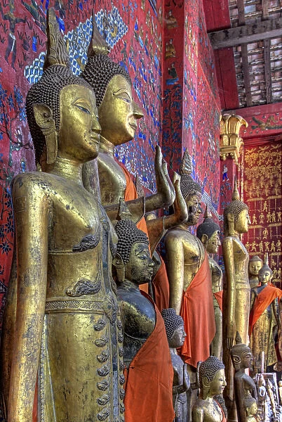 Southeast Asia, Laos, Luang Prabang. Statues of Buddha inside Buddhist temple. Credit as
