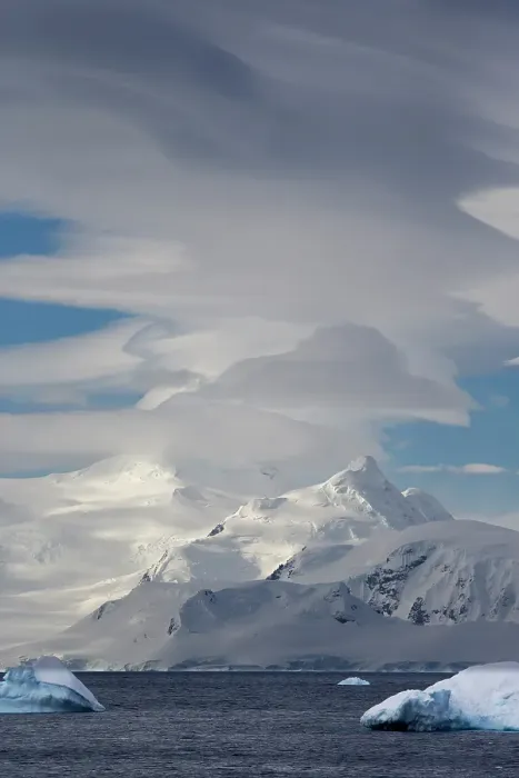 Framed Print : Southern Ocean, Antarctica, Northwest Peninsula. View of the mountains and the lenticular clouds Framed Print : Southern Ocean, Antarctica, Northwest Peninsula. View of the mountains and the lenticular clouds