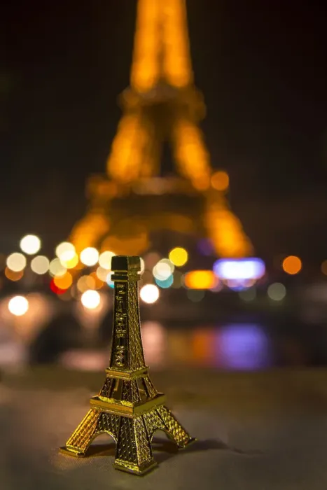 Framed Print : A souvenir Eiffel Tower on the wall of the Seine River across from the real thing Framed Print : A souvenir Eiffel Tower on the wall of the Seine River across from the real thing