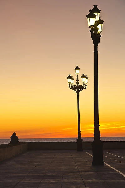 Spain, Andalucia Region, Cadiz Province, Cadiz, waterfront view, dusk