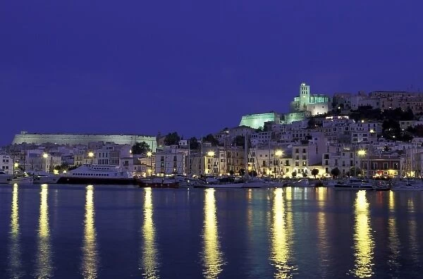 Spain, Balearics, Ibiza, Eivissa. City view from harbor, evening