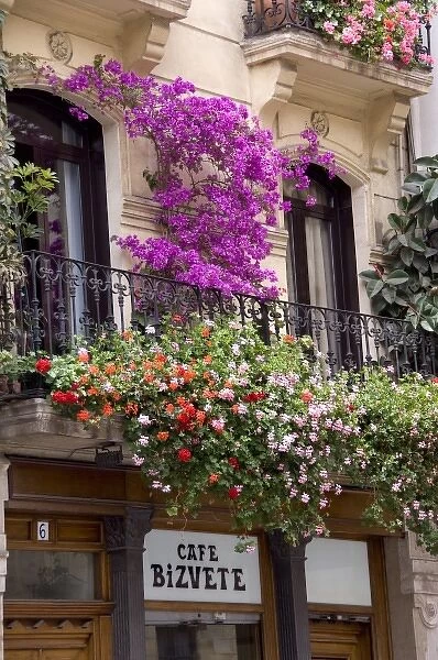 Spain, Bilbao. Flower covered balcony of Cafe Bizvete