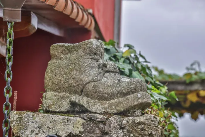 Framed Print : Spain, Galicia. Shoes along the Camino de Santiago (Way of St. James) between Lavacolla and Santiago de Compostela