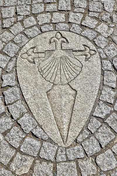 Spain, Galicia. Sword of the Knights Templar and clam shell in the path along the Camino de Santiago between Ventras de Naron and Palas de Rei