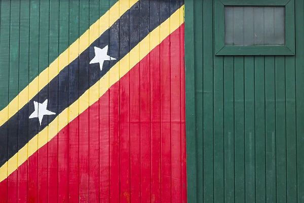 St. Kitts and Nevis, St. Kitts. Frigate Bay Beach, wall with St. Kitts flag