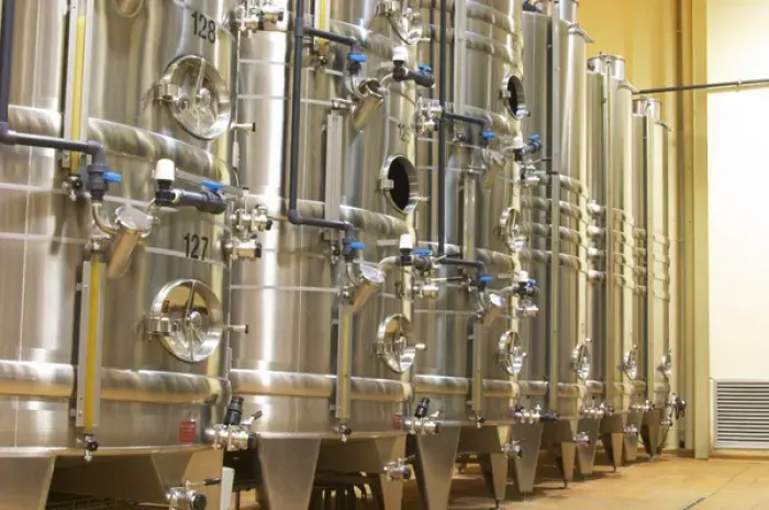 Framed Print : Stacks of stainless steel fermentation vats in various sizes and with cooling systems Framed Print : Stacks of stainless steel fermentation vats in various sizes and with cooling systems