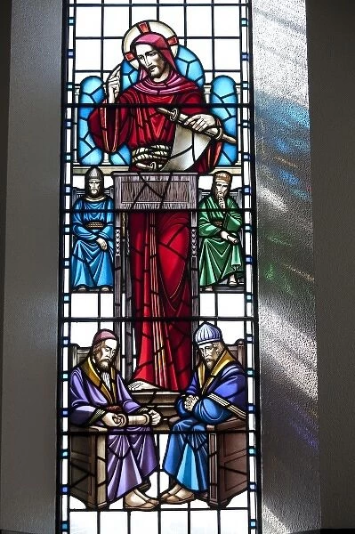 Stained glass window in Lutheran Church of Akureyri, Iceland shows Christ reading