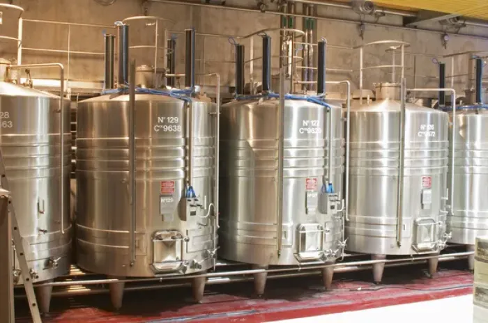 Framed Print : Stainless steel fermentation tanks with on top equipement for doing pigeage Framed Print : Stainless steel fermentation tanks with on top equipement for doing pigeage
