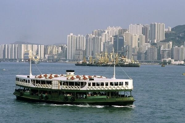 Star Ferry and skyscraper buildings at Hong Kong Harbor