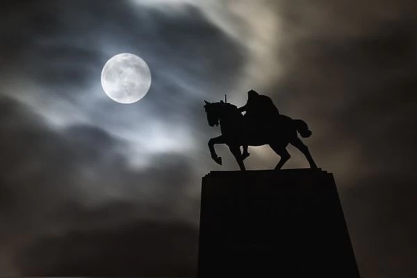Statue of King Kralja Tomislava silhouetted against full moon, Zagreb, Croatia (Digital