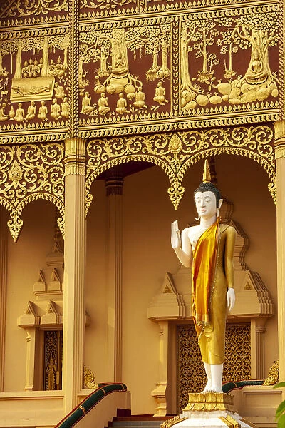 Statue in front of Wat That Luang Neua, one of the temples that surround Pha That Luang