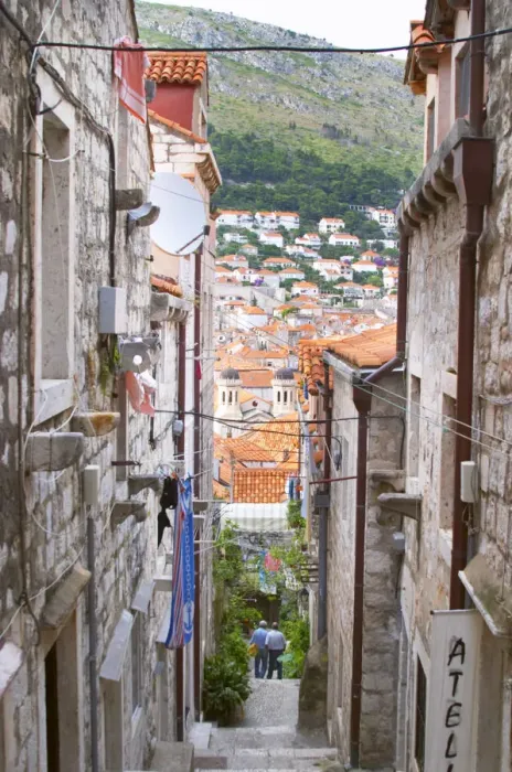 Framed Print : A steep street leading down from the city wall to the city and a view over rooftops Framed Print : A steep street leading down from the city wall to the city and a view over rooftops