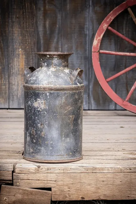 Framed Print : Still-life of old milk can and wagon wheel Framed Print : Still-life of old milk can and wagon wheel