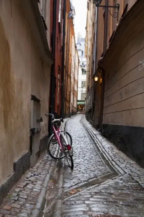 Framed Print : Stockholm, Sweden - A bicycle sitting in a narrow alley going between two old world buildings Framed Print : Stockholm, Sweden - A bicycle sitting in a narrow alley going between two old world buildings