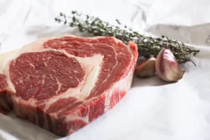 Framed Print : Stockholm, Sweden - Closeup image of a steak, cloves of garlic and fresh herbs