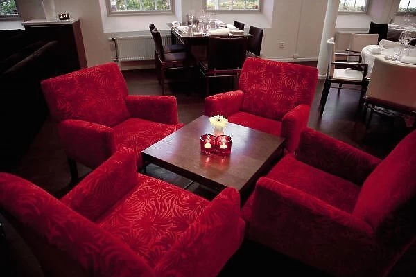 Stockholm, Sweden - High angle view of four red chairs around a small coffee table
