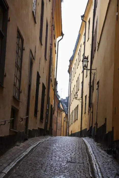 Framed Print : Stockholm, Sweden - A narrow alley going between two old world buildings. Vertical shot
