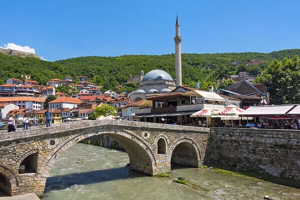 Stone bridge, Sinan Pasha Mosque and houses in the old town on the banks of the Prizren