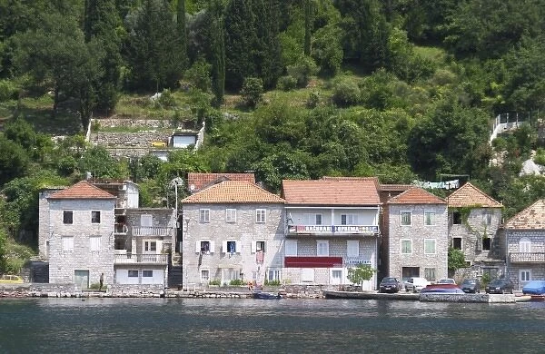 Stone houses along the water edge in Lepetani. Montenegro, Balkan, Europe