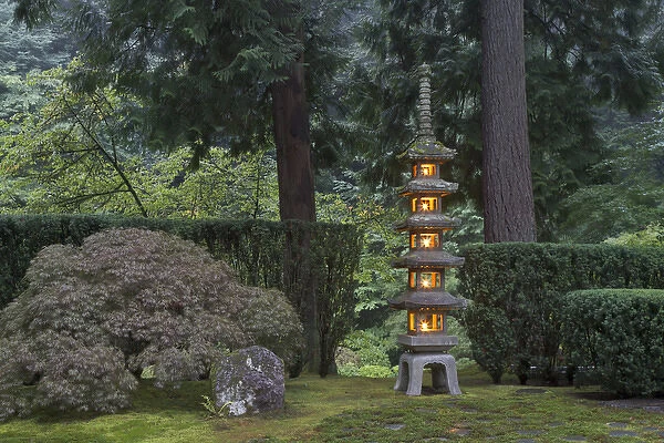 Stone lantern illuminated with candles, Portland Japanese Garden, Oregon