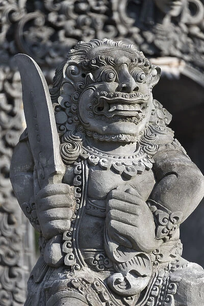 Stone statue at entrance of Tanah Lot. Bali island, Indonesia