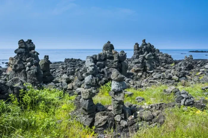 Framed Print : Stone walls made by tourists on the Unesco world heritage sight the island of Jejudo Framed Print : Stone walls made by tourists on the Unesco world heritage sight the island of Jejudo