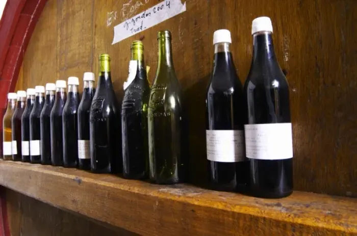 Framed Print : Storage vats for aging with sample bottles of wine on the cross bar. Domaine la Tourade Framed Print : Storage vats for aging with sample bottles of wine on the cross bar. Domaine la Tourade