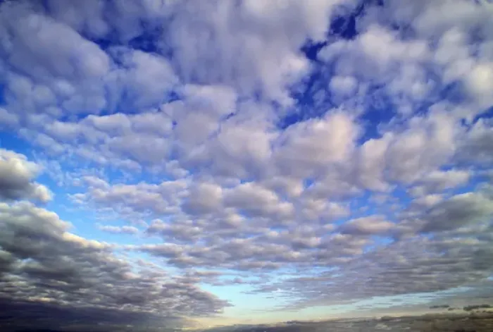 Framed Print : The storm clouds break up to reveal the blue early morning sky above Framed Print : The storm clouds break up to reveal the blue early morning sky above