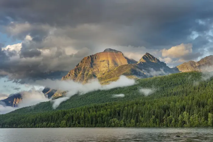 Framed Print : Stormy late afternoon light on Rainbow Peak at Bowman Lake in Glacier National Park