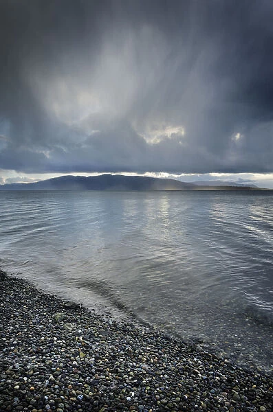 Stormy winter clouds over Bellingham Bay, Washington State. Lummi Island in the distance